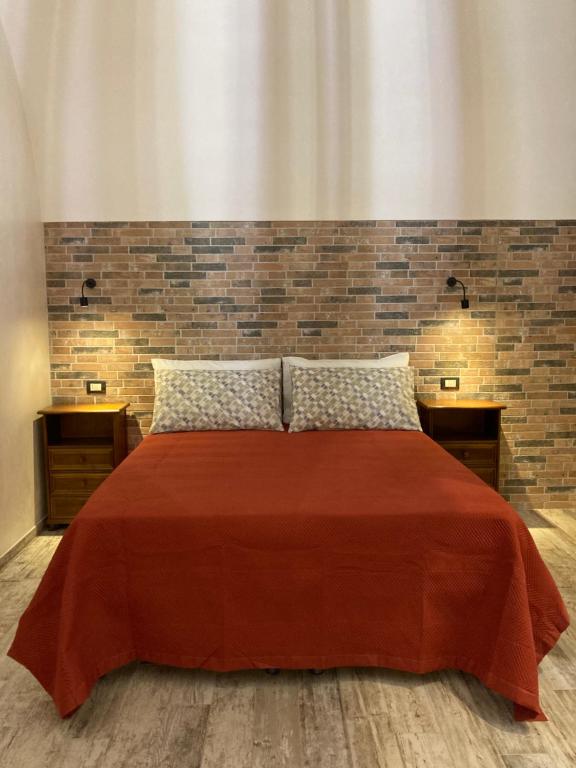 Ein Bett oder Betten in einem Zimmer der Unterkunft Il turista russo