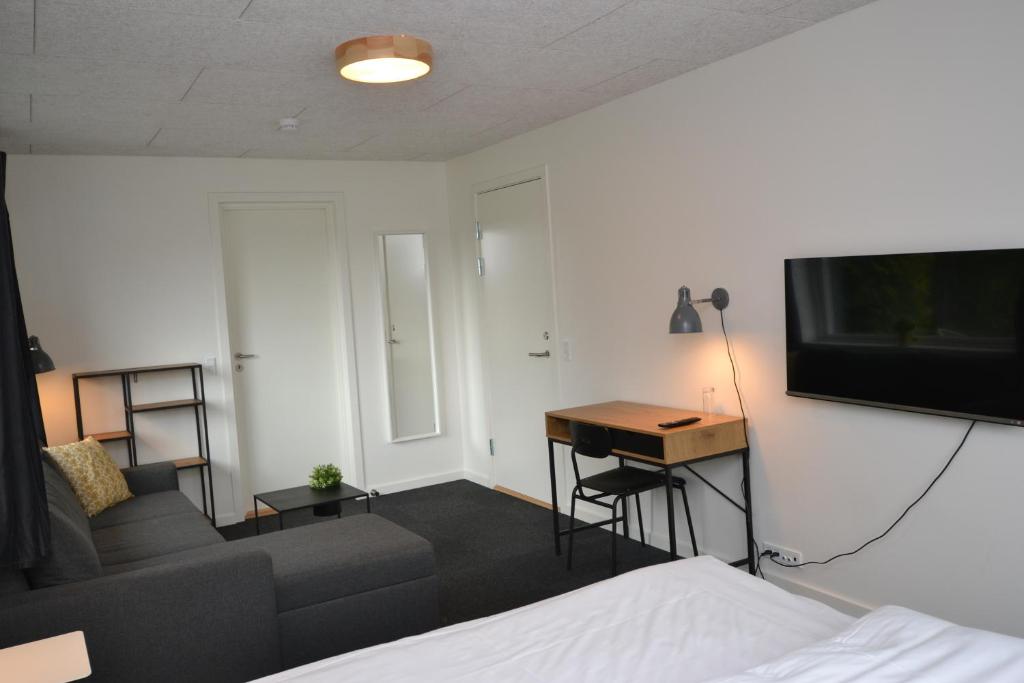 Postel nebo postele na pokoji v ubytování Dalby Hotel