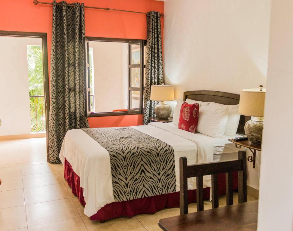 Postel nebo postele na pokoji v ubytování Hotel Ciudad Blanca
