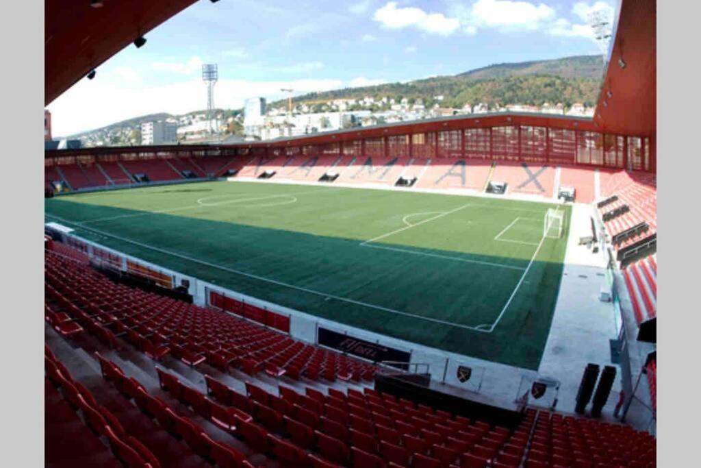 an empty stadium with a tennis court in it at Beautiful Cocoon in Neuchâtel