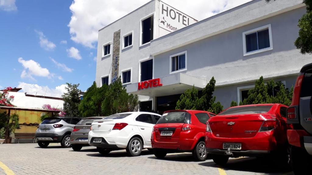 a number of cars parked in front of a building at Hotel Aeroporto Montese Star in Fortaleza
