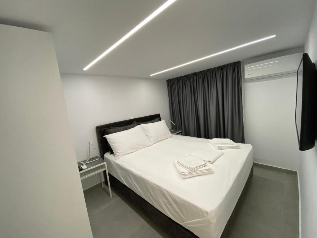 Posteľ alebo postele v izbe v ubytovaní Hotel Alex