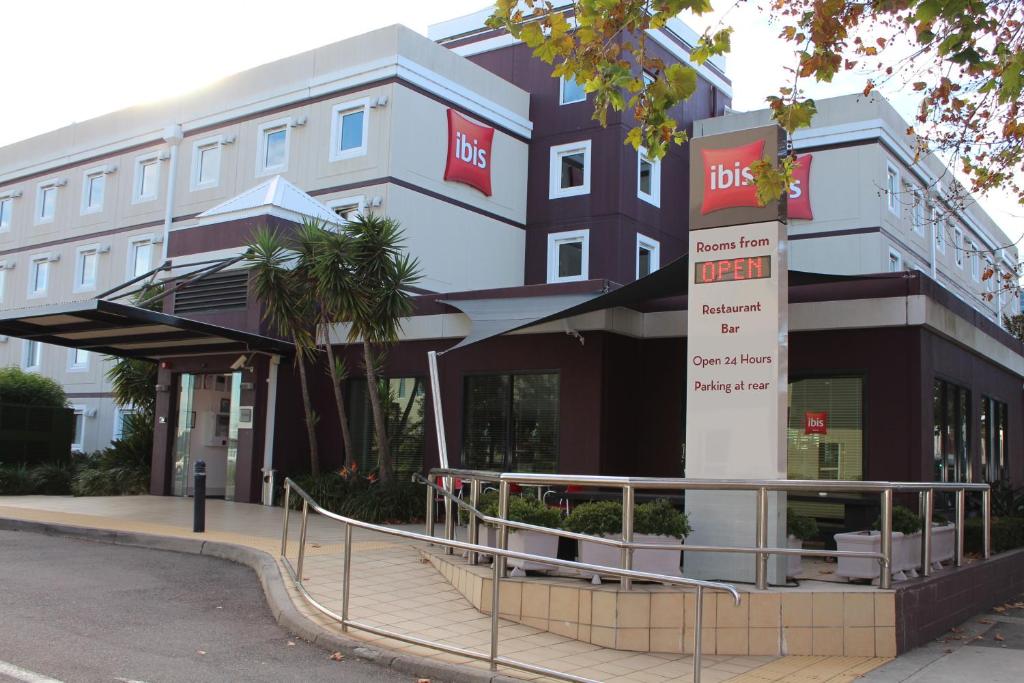 a building with a sign in front of it at ibis Newcastle in Newcastle