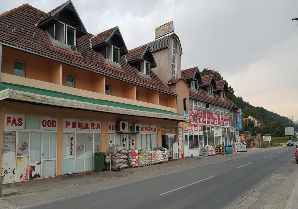 a row of buildings on the side of a street at Guesthouse Meče in Bijelo Polje