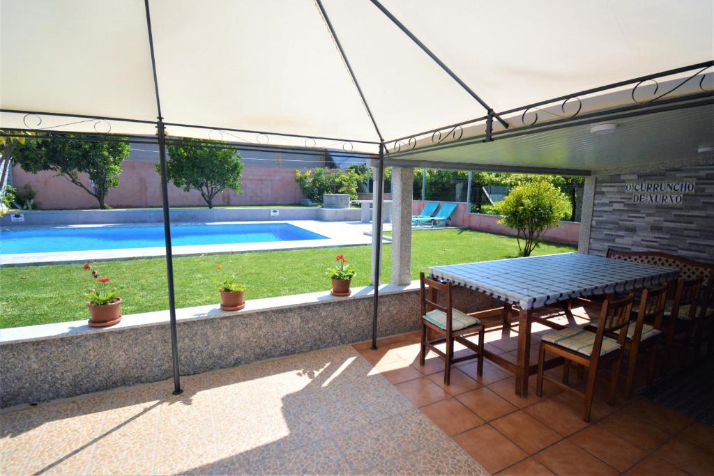 Bazén v ubytování Casa con piscina en Cambados nebo v jeho okolí