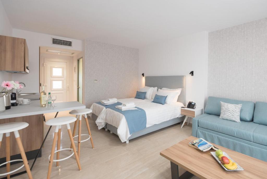 Postel nebo postele na pokoji v ubytování Hotel Defkalion