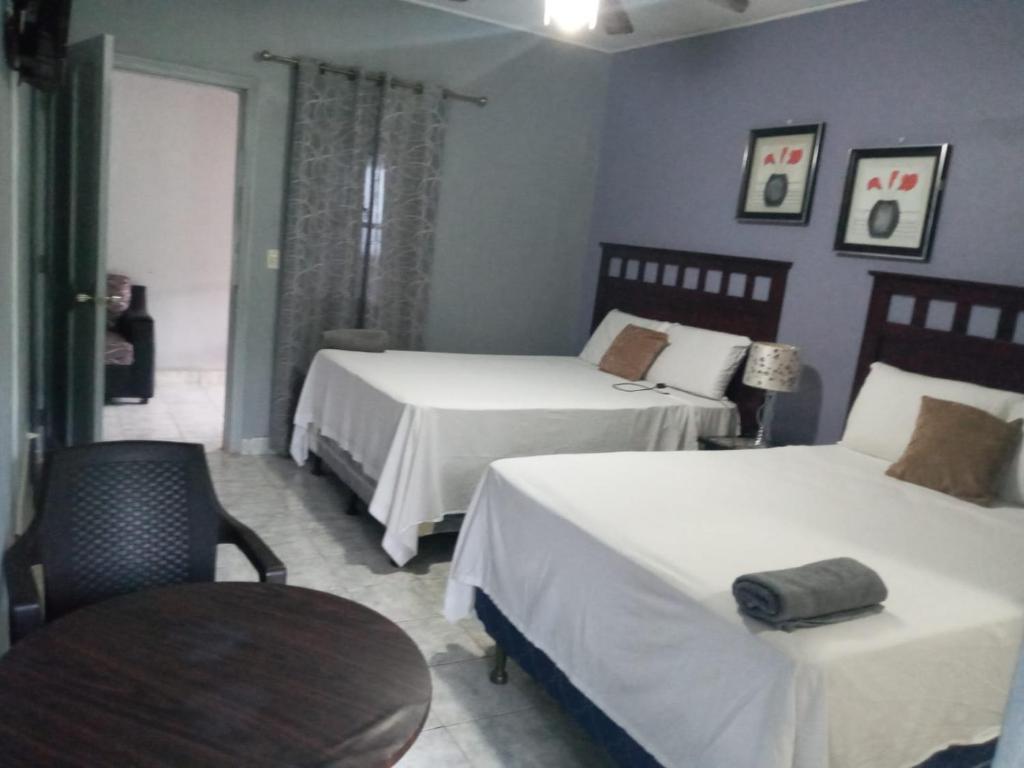 Postel nebo postele na pokoji v ubytování Hotel Vista del Mar