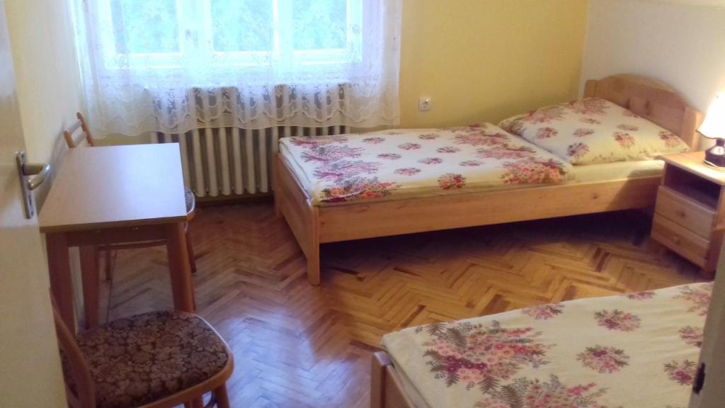 Postel nebo postele na pokoji v ubytování Tiszafa Apartman