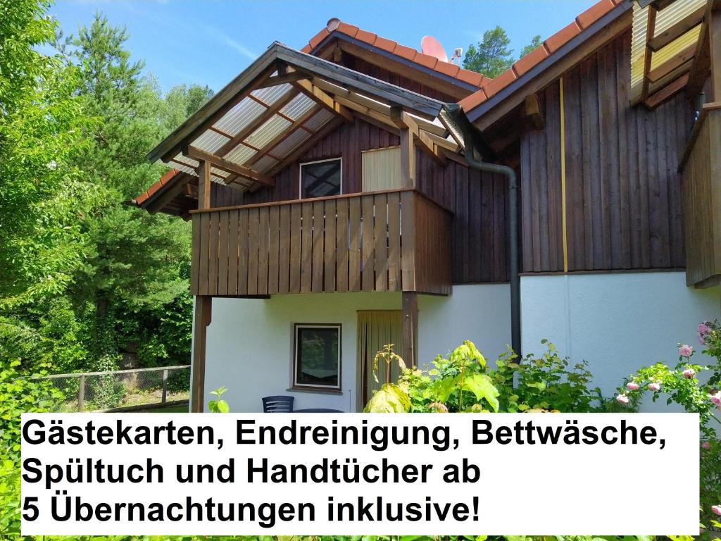 a house with the words gardening engineering and architecture reimplementation inclusive at CU-Ferienwohnungen - nur für Urlaubsgäste in Grafenwiesen