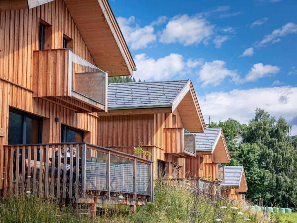 a row of wooden houses with balconies on them at Gorgeous Chalet in Steinach am Brenner near Ski Area in Steinach am Brenner