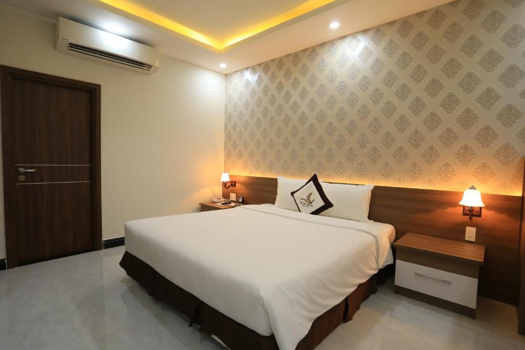 Phung Hung Boutique Hotelにあるベッド