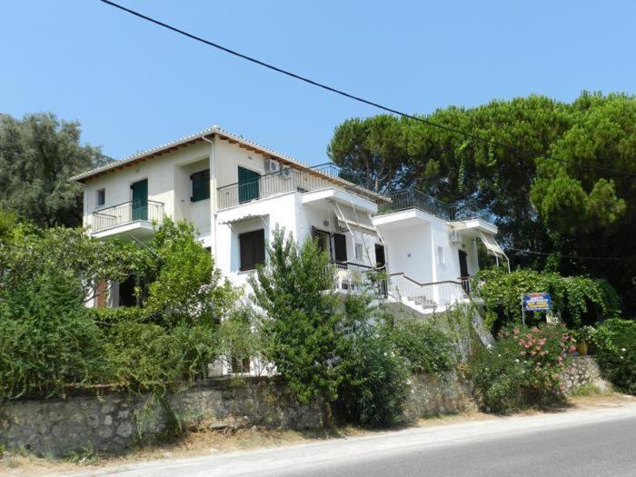 a white house on the side of a road at Georgia in Nikiana