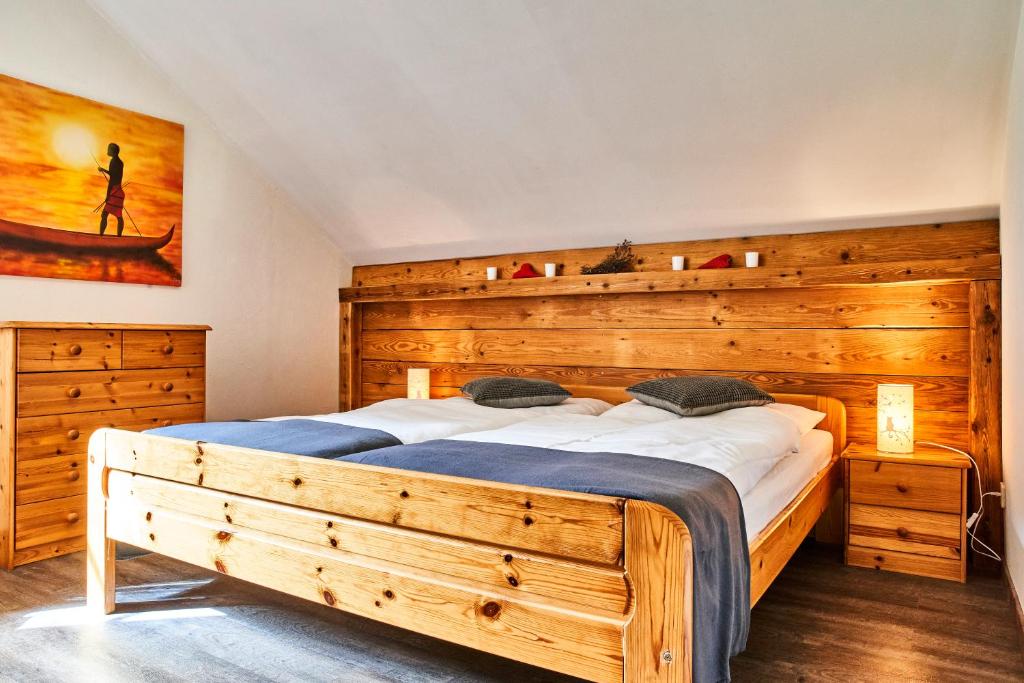 a bedroom with a large wooden bed in a room at Apartment Fuchswald in Lackenhof