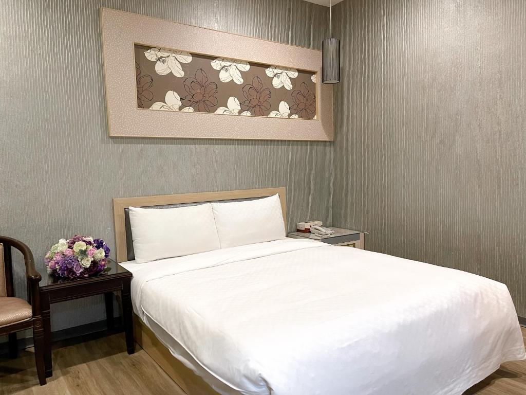 Postel nebo postele na pokoji v ubytování Beidoo Hotel