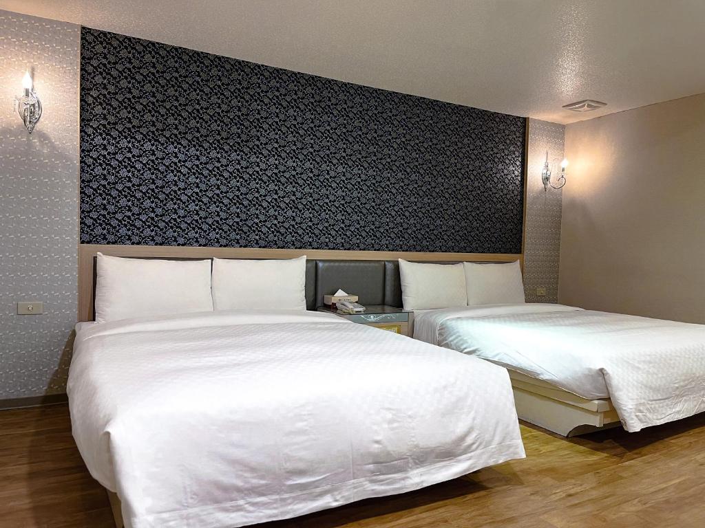 Postel nebo postele na pokoji v ubytování Beidoo Hotel