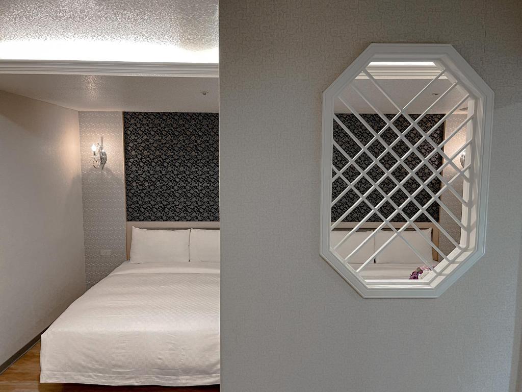 Postel nebo postele na pokoji v ubytování Beidoo Hotel