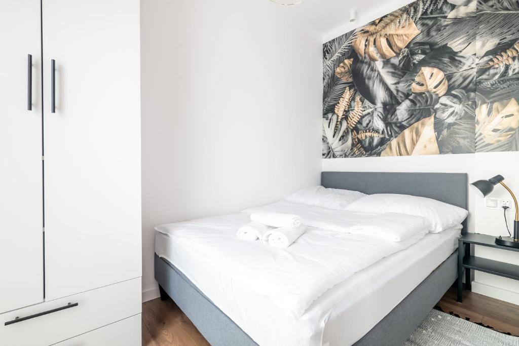 Posteľ alebo postele v izbe v ubytovaní Nice Apartments