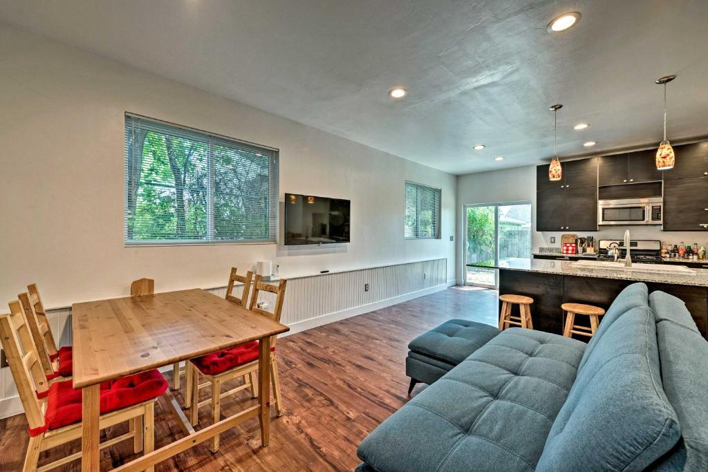 a living room with a couch and a table at Cozy Salt Lake City Townhouse - Close to Downtown! in Salt Lake City