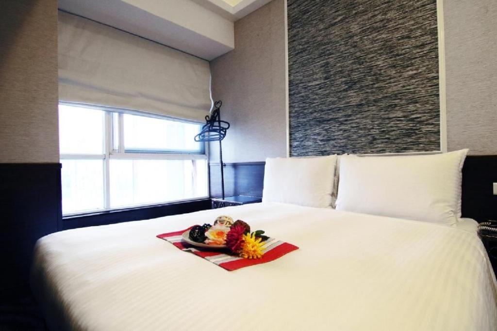 Postel nebo postele na pokoji v ubytování Hotel 6 - Ximen