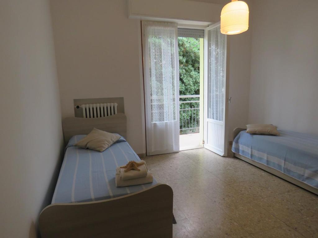 Łóżko lub łóżka w pokoju w obiekcie Appartamenti Tevere