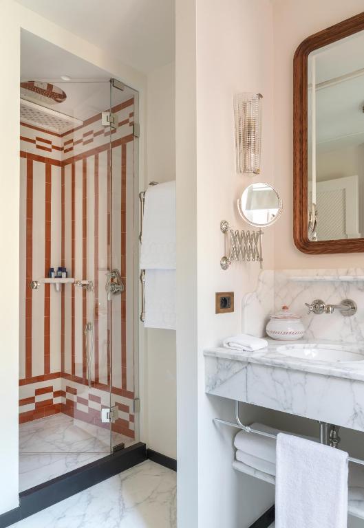 a bathroom with a sink and a mirror at Splendido Mare, A Belmond Hotel, Portofino in Portofino