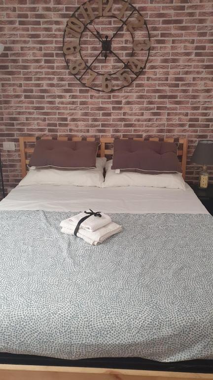 Postel nebo postele na pokoji v ubytování Hercules House - Il riposo degli Eroi