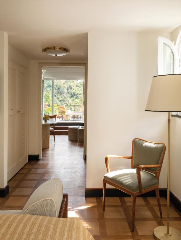 a living room with a couch and a chair at Splendido Mare, A Belmond Hotel, Portofino in Portofino