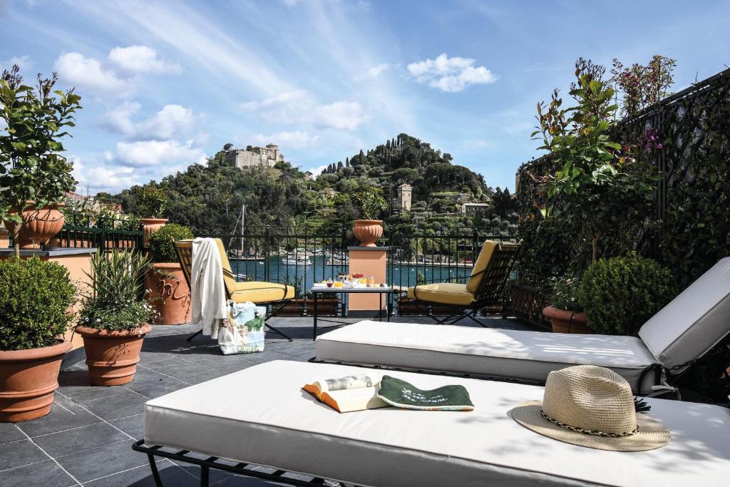a balcony with a view of a mountain at Splendido Mare, A Belmond Hotel, Portofino in Portofino