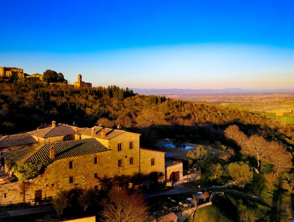 an aerial view of a building on a hill at Agriturismo La Chiusa Tuscany in Montefollonico