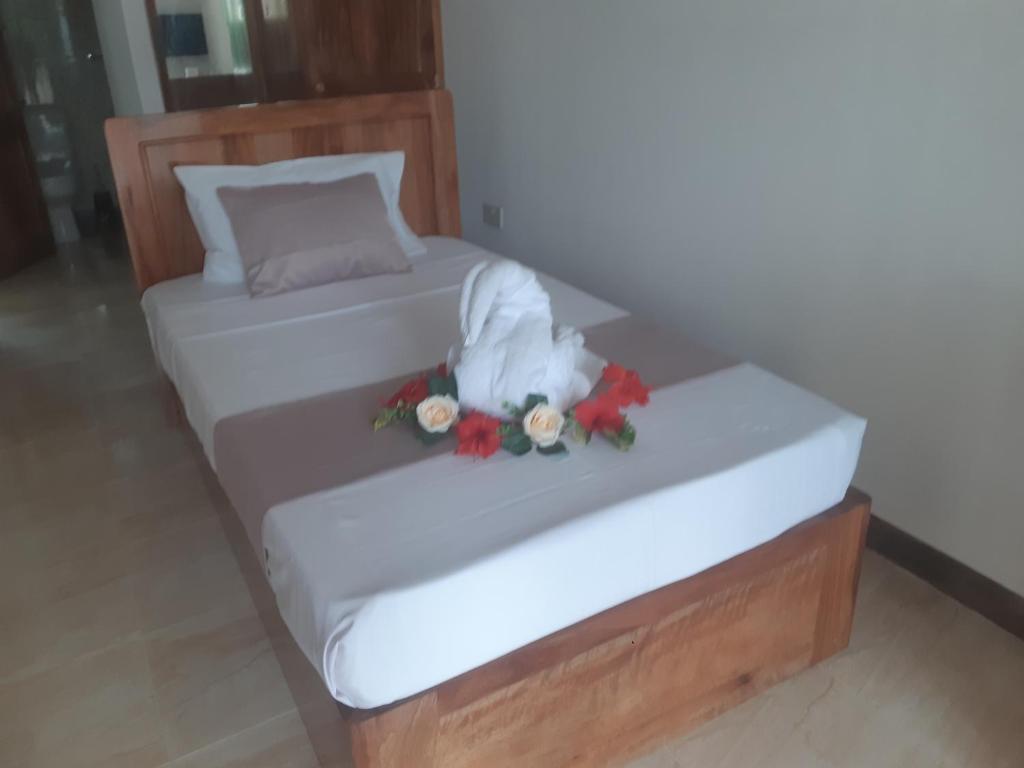 Postel nebo postele na pokoji v ubytování La Residence D'Almee Guesthouse