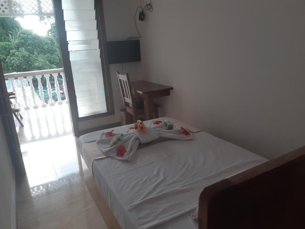 Postel nebo postele na pokoji v ubytování La Residence D'Almee Guesthouse