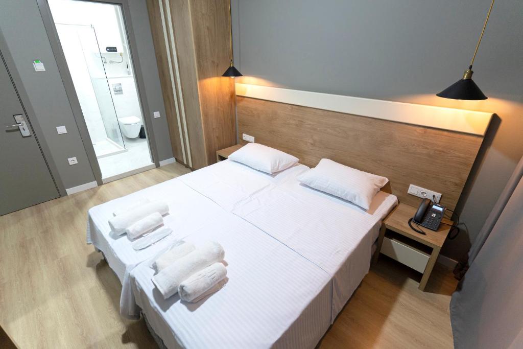 Postel nebo postele na pokoji v ubytování boulevard apartments