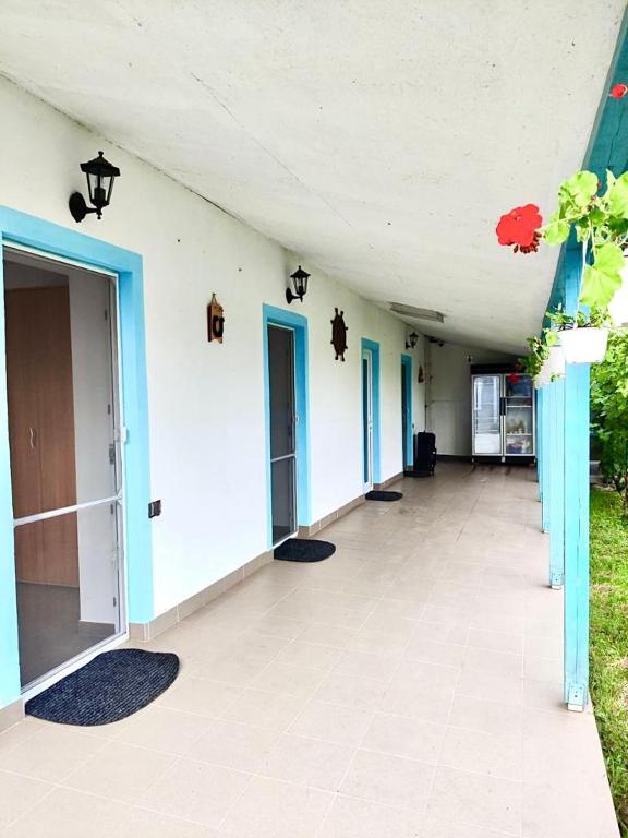 an empty hallway of a building with blue and white walls at Casa Anna in Chilia Veche