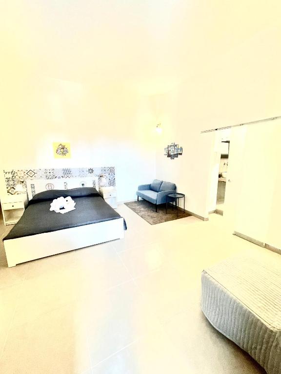 Postel nebo postele na pokoji v ubytování Hercules Suites