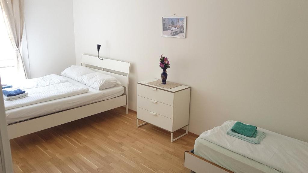 Voodi või voodid majutusasutuse Sobieski Inner Ring Apartments toas