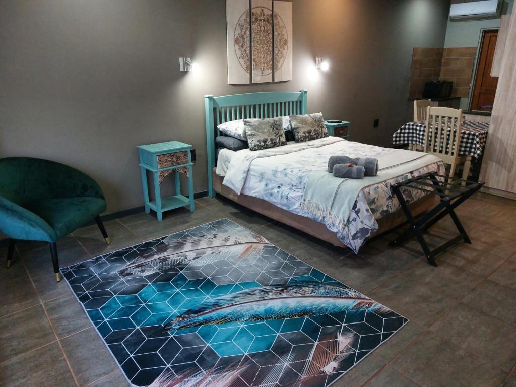a bedroom with a bed with a fish rug at Wisteria Lane Guesthouse in Postmasburg