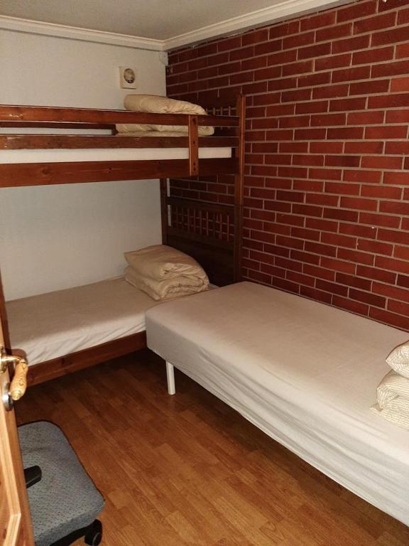 Postel nebo postele na pokoji v ubytování Gardenview Room