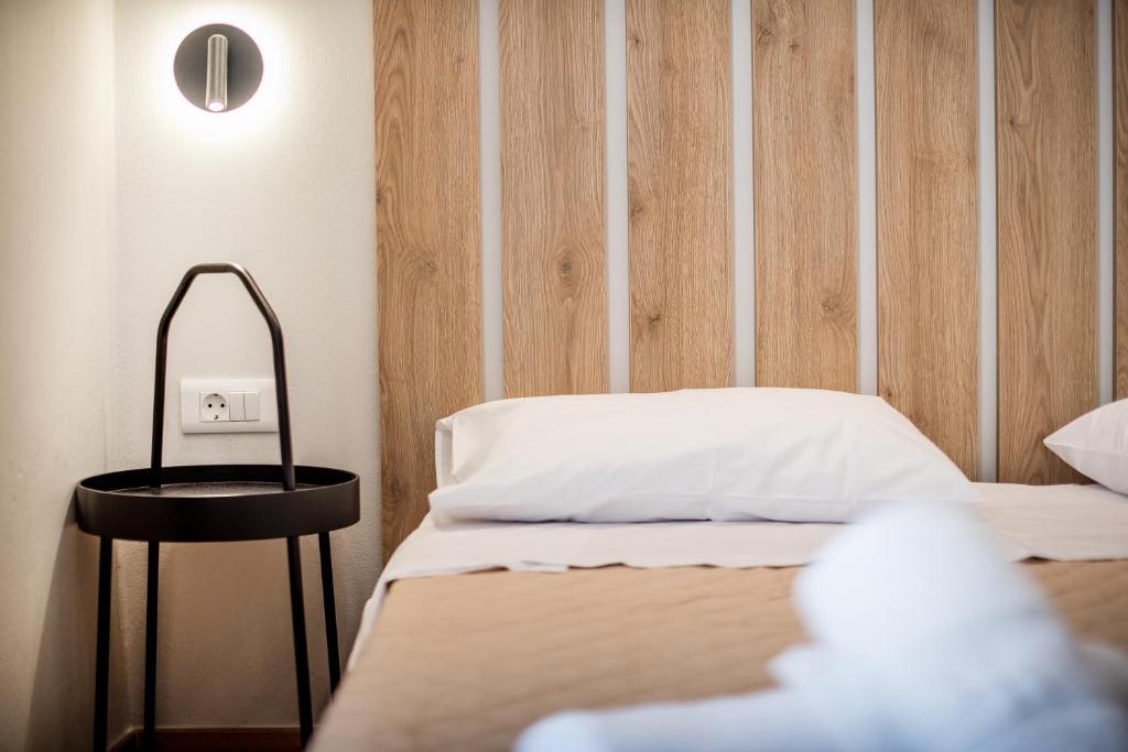 A bed or beds in a room at Evangeline Maisons