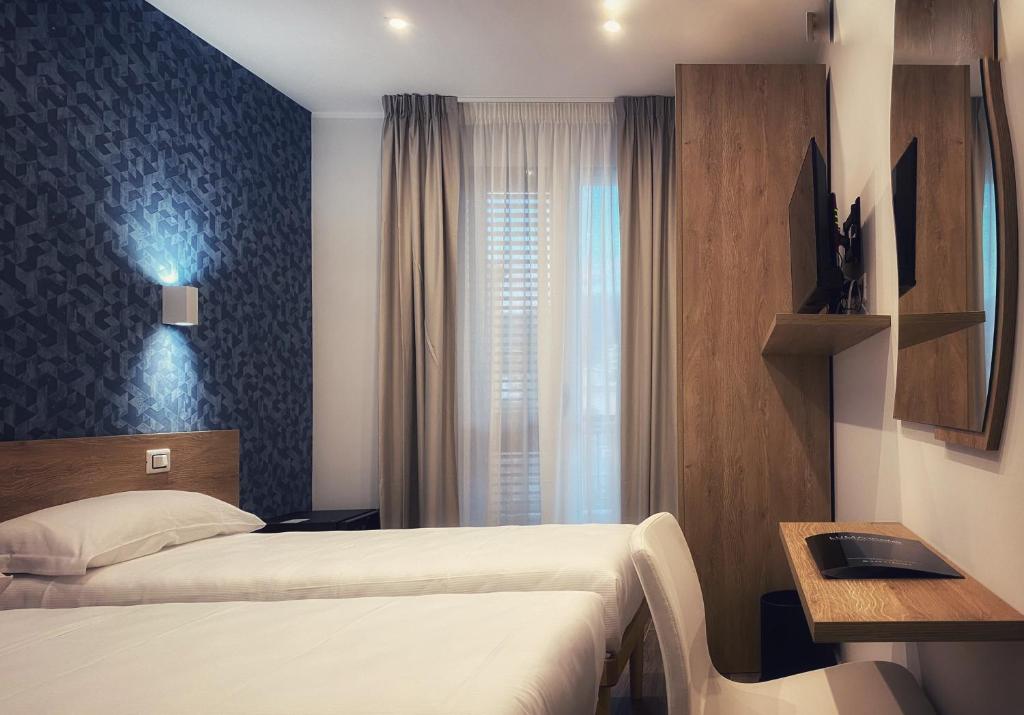Postel nebo postele na pokoji v ubytování Lumarooms B&B