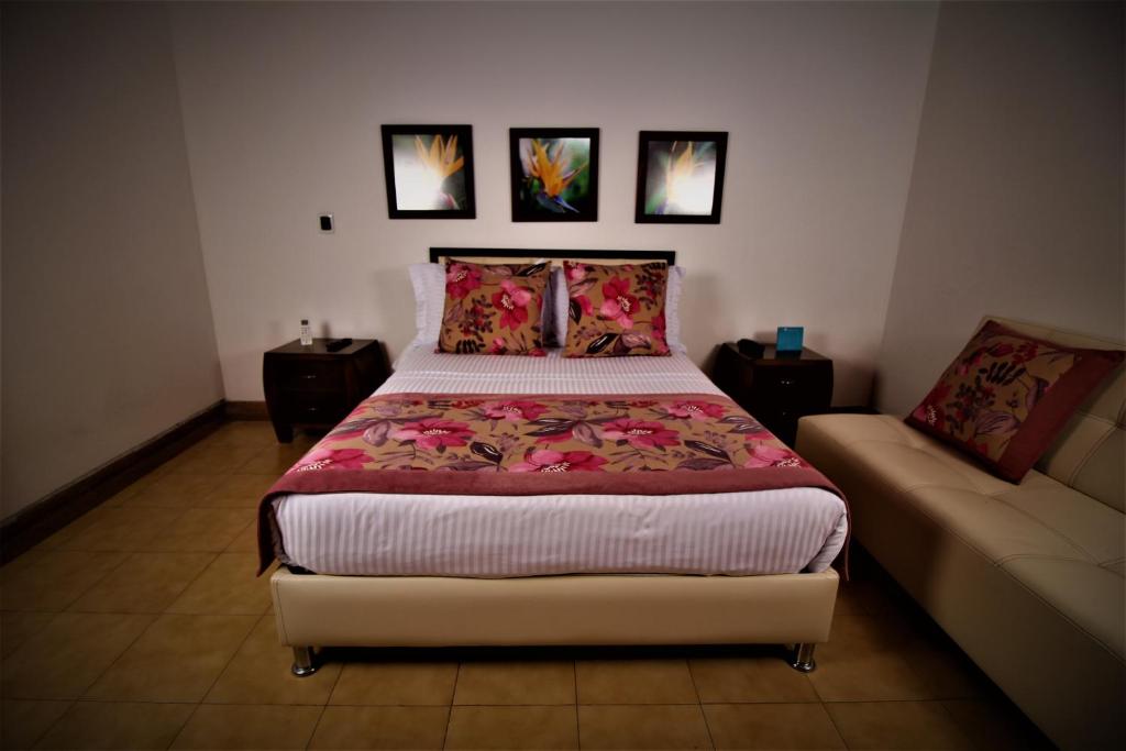 Postel nebo postele na pokoji v ubytování Amazilia Hotel