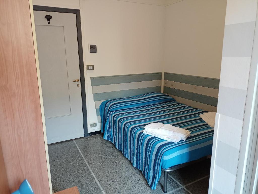 Postel nebo postele na pokoji v ubytování Hotel Mignon Posta