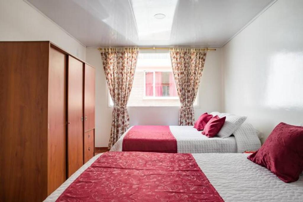 Postel nebo postele na pokoji v ubytování Touristic House