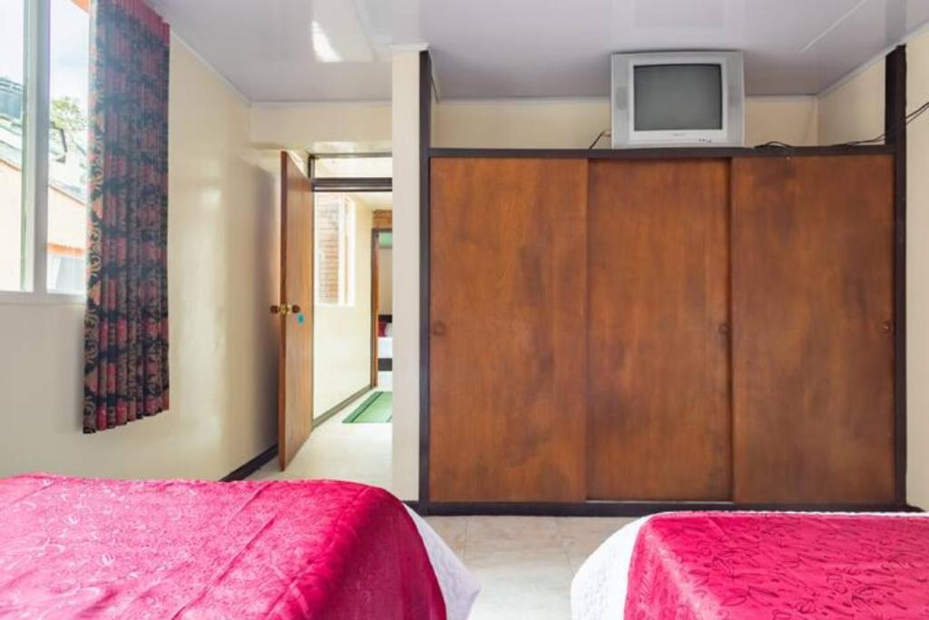 Postel nebo postele na pokoji v ubytování Touristic House