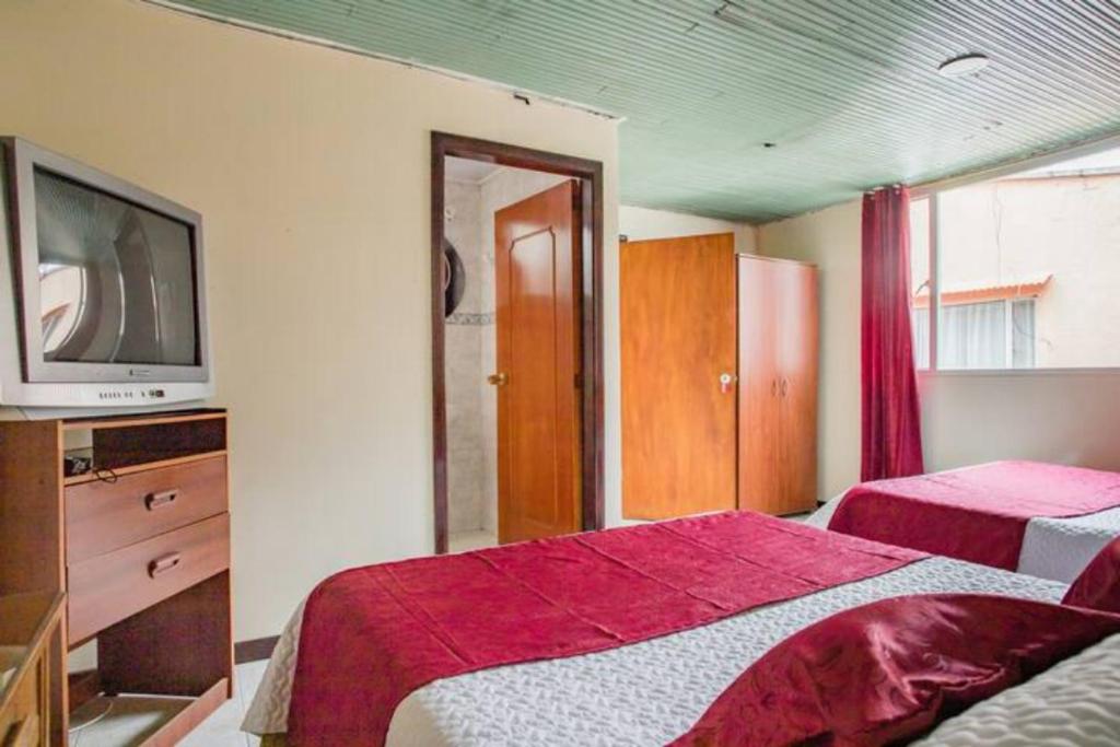 Postel nebo postele na pokoji v ubytování Touristic House