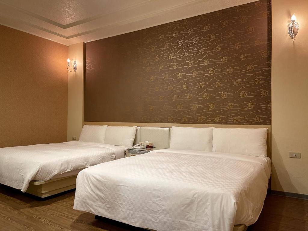 Postel nebo postele na pokoji v ubytování Beidoo Hotel