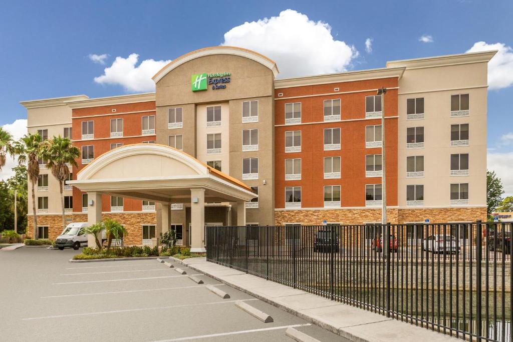 a hotel building with a fence in front of it at Holiday Inn Express Hotel & Suites Largo-Clearwater, an IHG Hotel in Largo