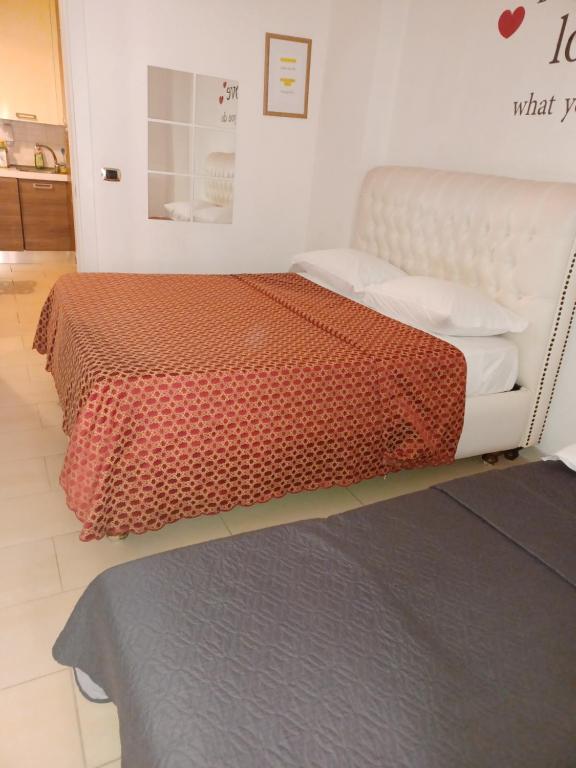 En eller flere senge i et værelse på San Sebastiano Apartment