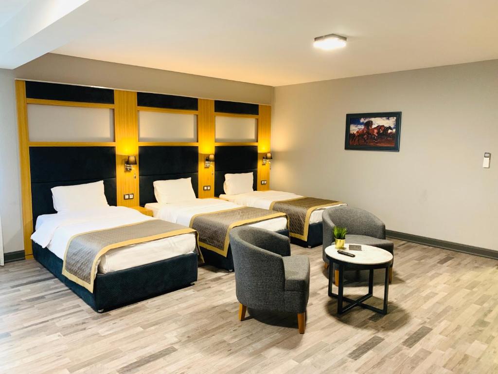 Postel nebo postele na pokoji v ubytování Hotel Konak