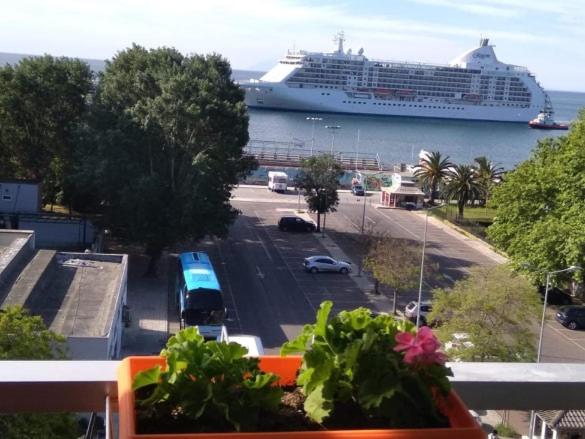 a cruise ship is docked in a harbor at Maria's Apartment in Kavala