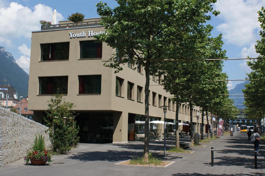 a building with a sign on the side of it at Interlaken Youth Hostel in Interlaken